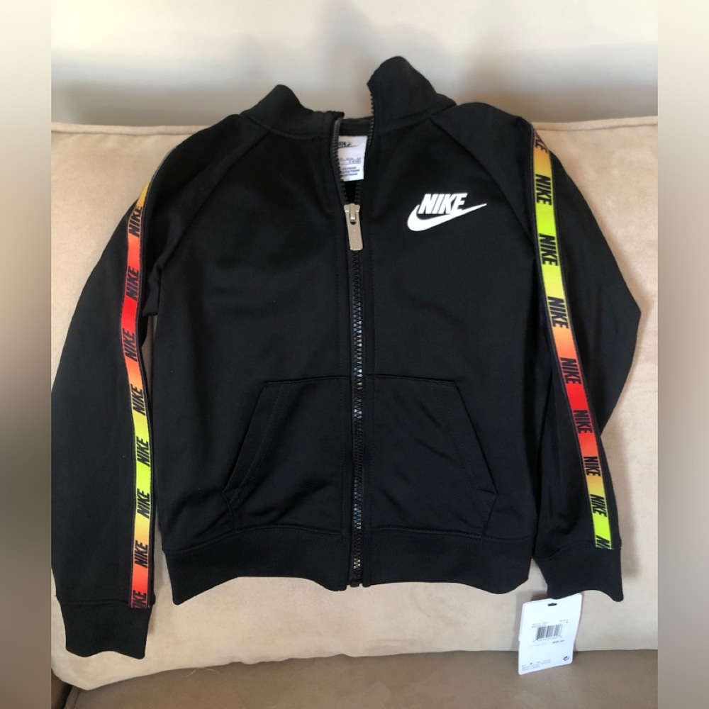 Kids Nike zip up with colorful stripe down the arm. Size 3/4